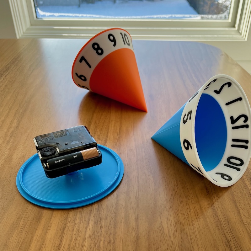 A couple of cone clocks, disassembled.