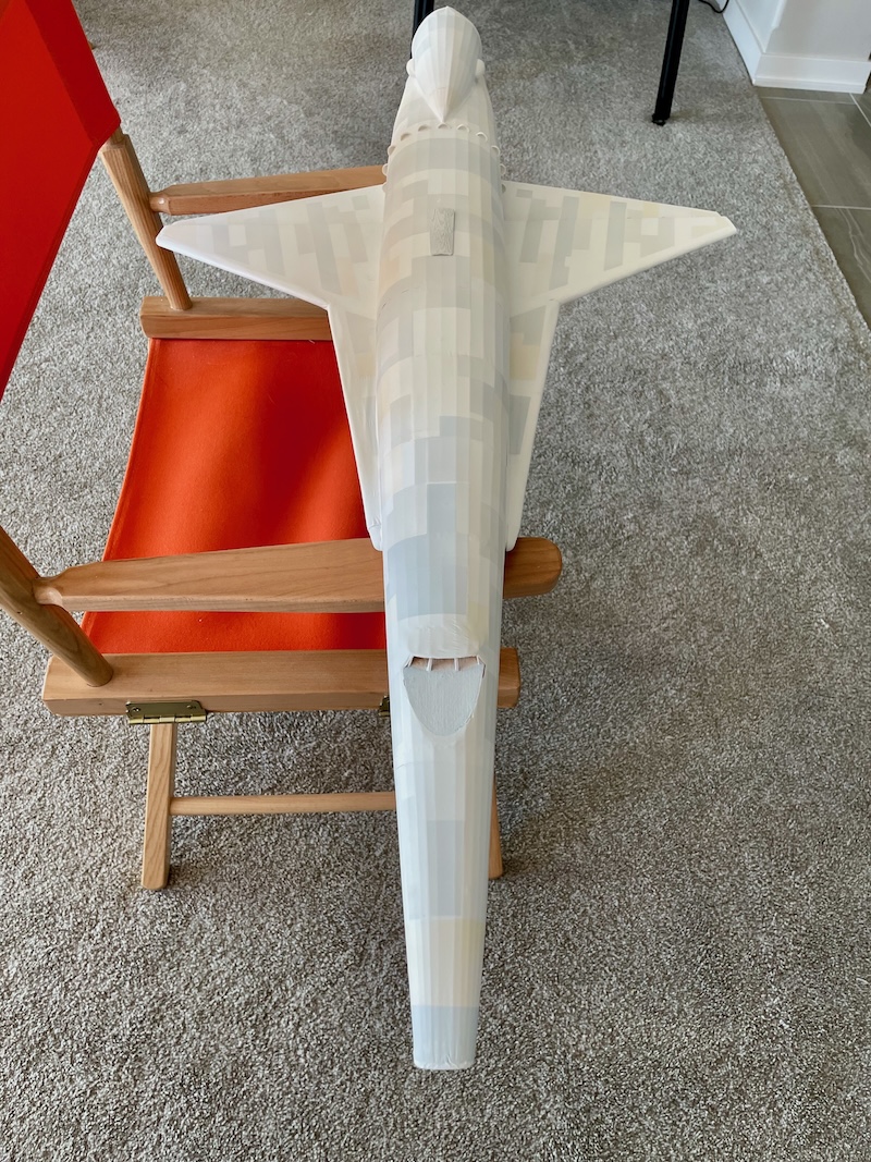 The shades of grey are taken down with thin white coats of paint.