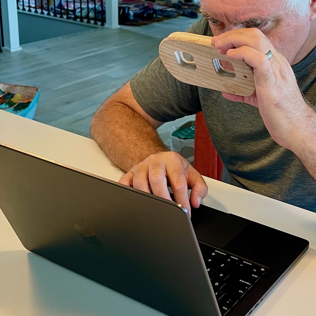 Viewing images on a MacBook with a partial stereoscope.